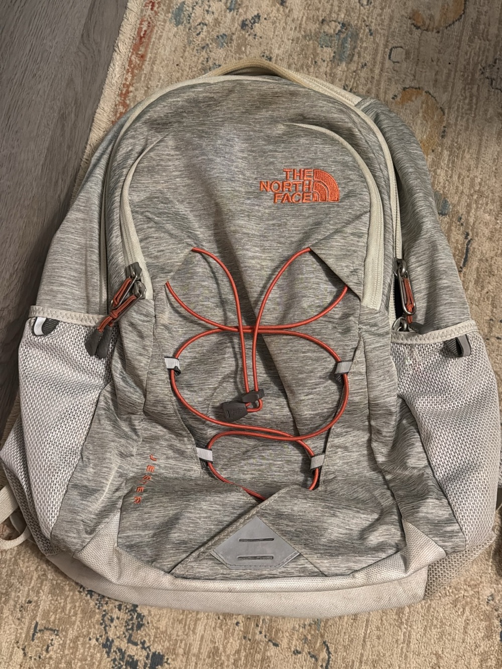 The North Face Light Gray Backpack with Orange Accents